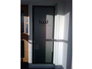 window flood coated with etched glass vinyl with logo cut out