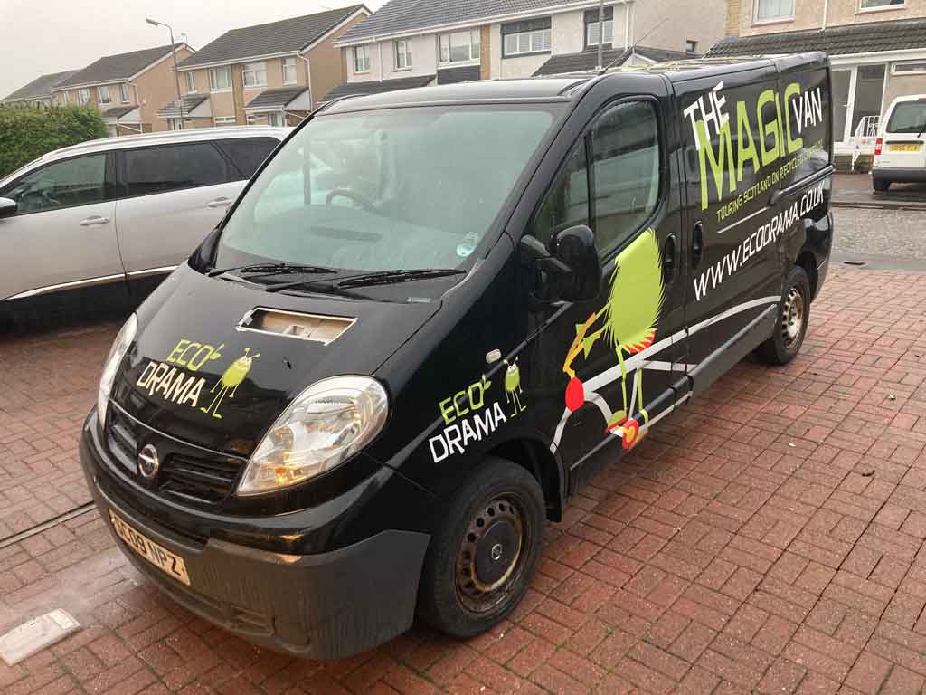 Van that has been completely wrapped in vinyl and cut vinyl sticker about to to have a complete removal